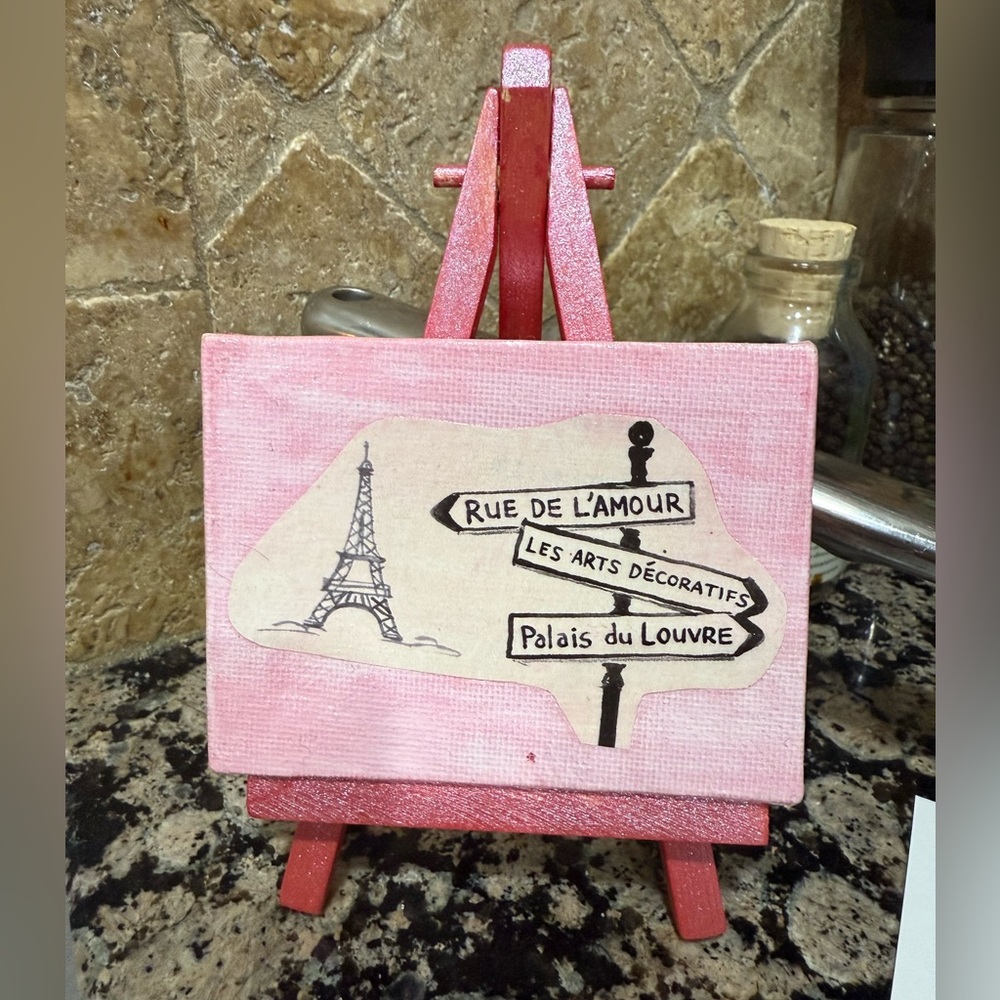 Small Parisian artwork and easel stand